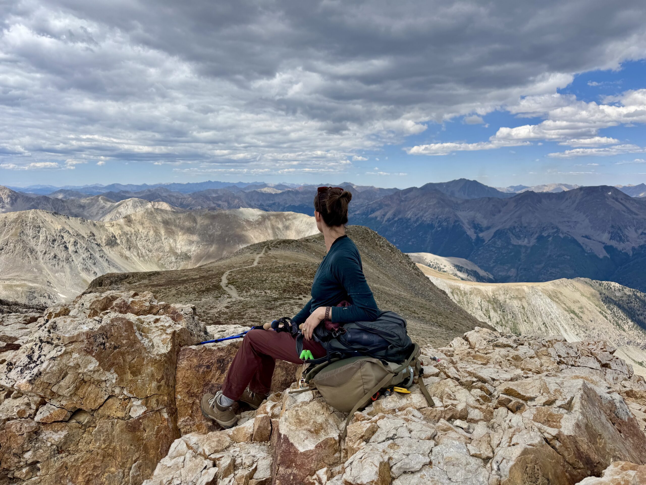 Life coach on top of a mountain contemplation the new year