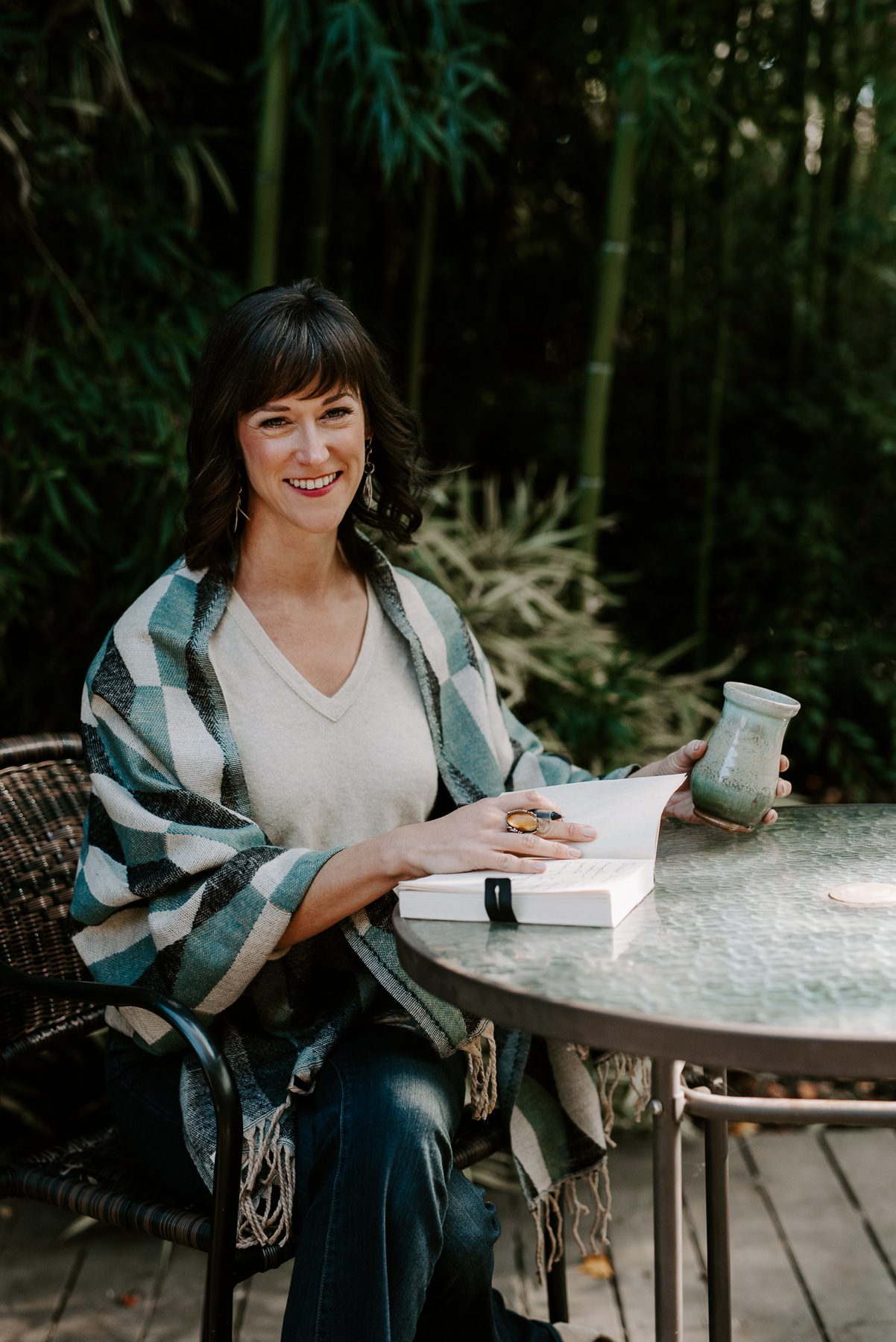 life coach on patio office in Charlotte nc with journal